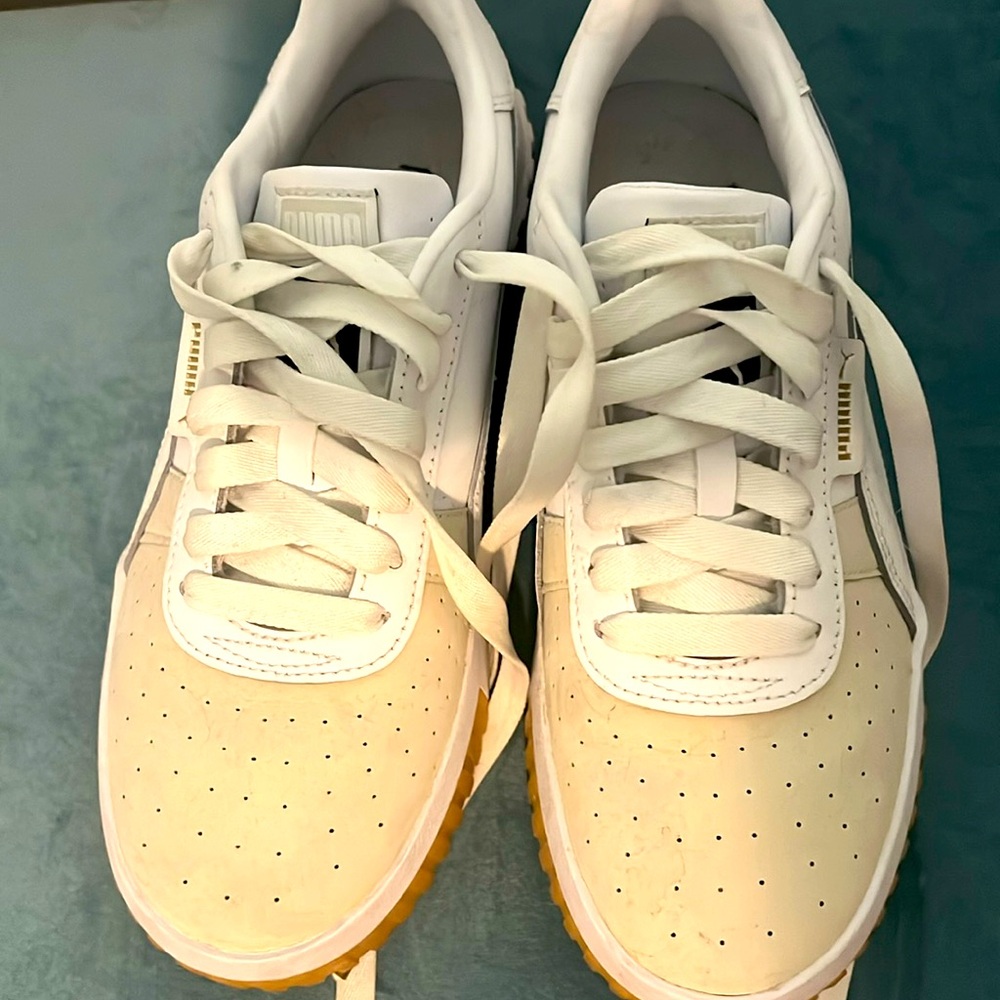 White Pumas sneakers